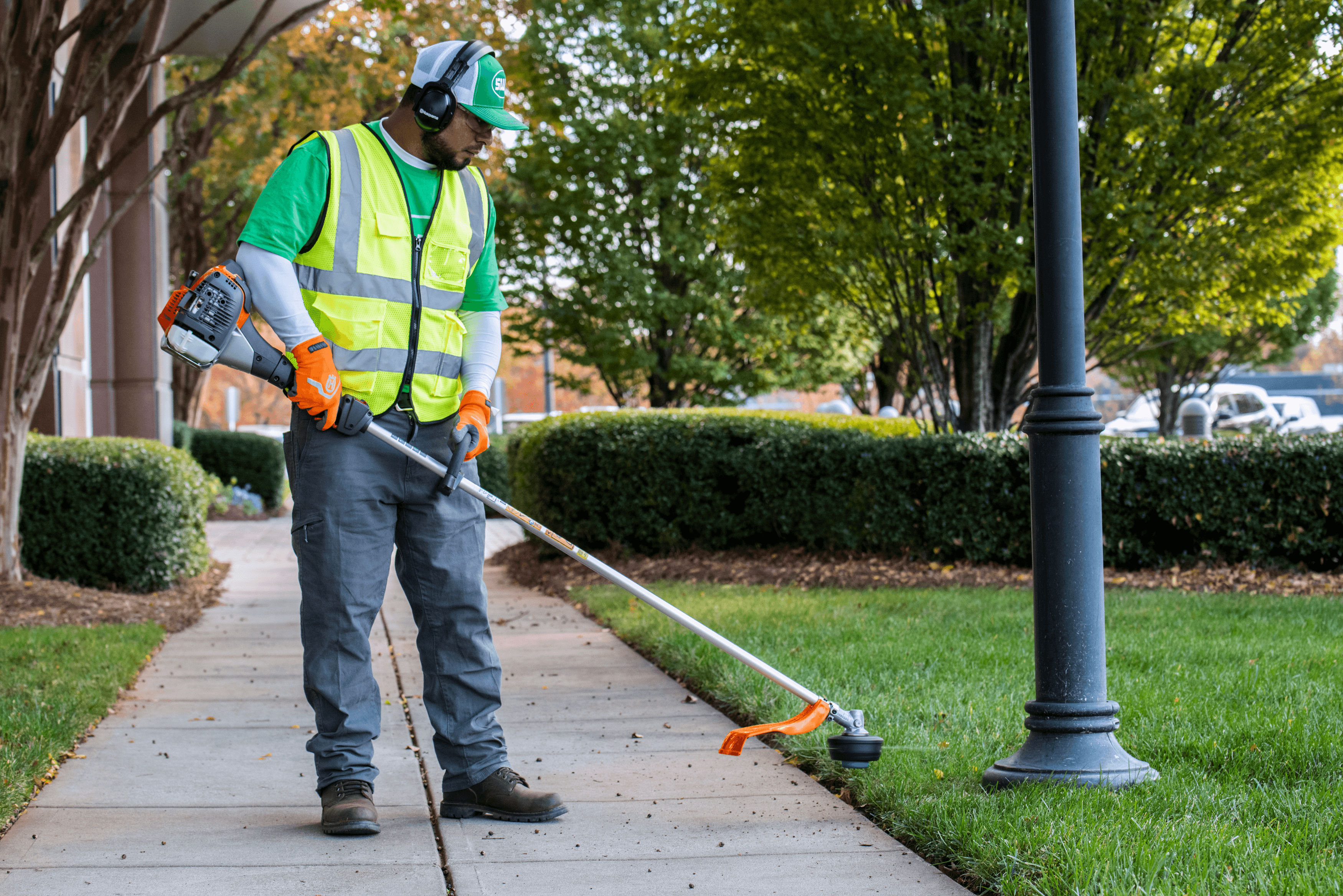 man wearing ppe with chainsaw